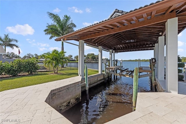 dock area featuring a yard and a water view