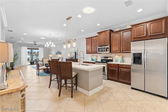 kitchen featuring ceiling fan, sink, stainless steel appliances, decorative light fixtures, and ornamental molding