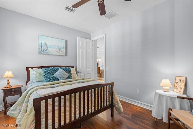 bedroom with dark hardwood / wood-style floors and ceiling fan