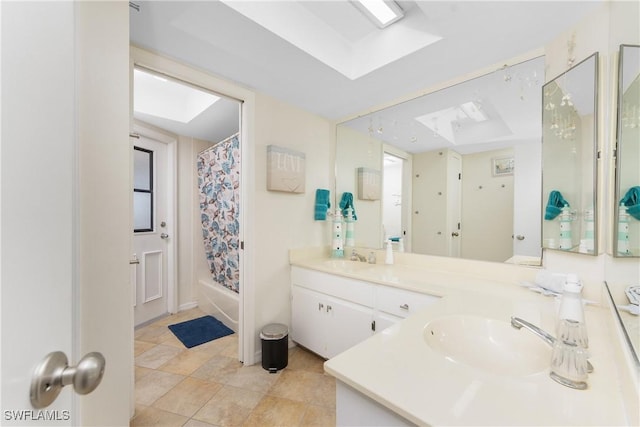 bathroom with vanity, shower / tub combo, and a skylight