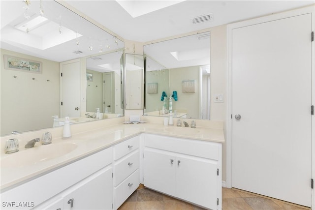 bathroom with vanity and a skylight