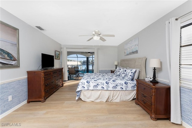 bedroom with access to outside, ceiling fan, and light hardwood / wood-style flooring