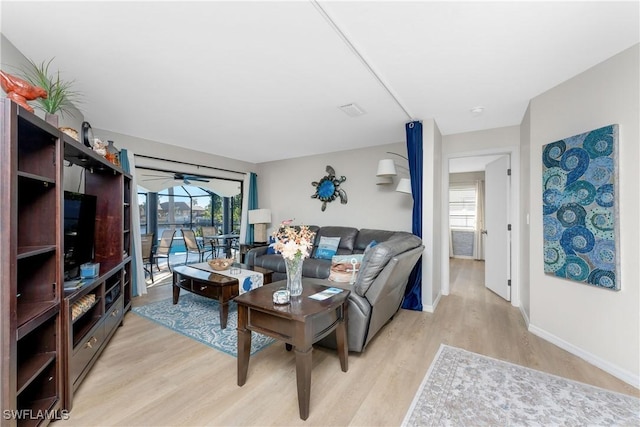 living room with a healthy amount of sunlight and light wood-type flooring