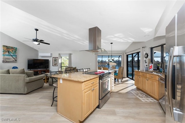 kitchen with a breakfast bar, lofted ceiling, light stone countertops, island exhaust hood, and stainless steel appliances