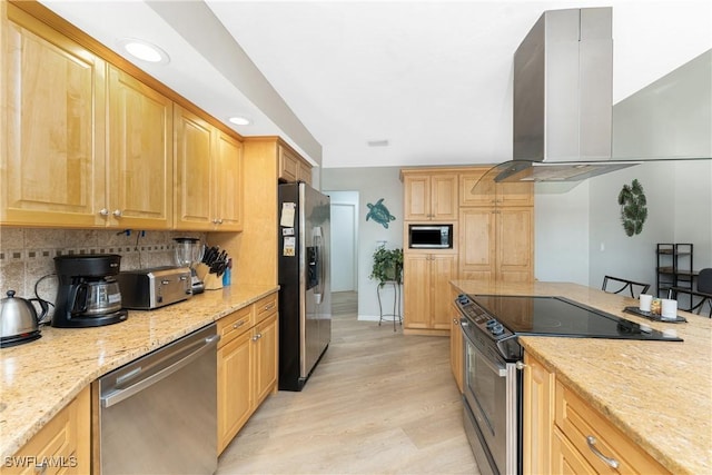 kitchen with light stone countertops, light wood-type flooring, tasteful backsplash, island exhaust hood, and stainless steel appliances