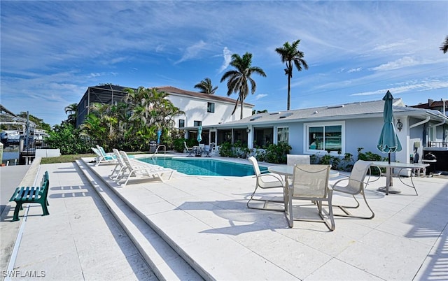 view of swimming pool featuring a patio