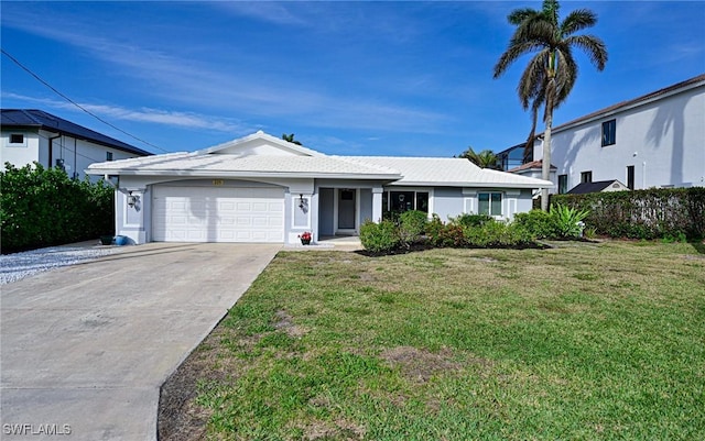 view of front facade with a garage and a front yard