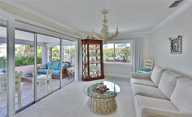 carpeted living room featuring an inviting chandelier and ornamental molding