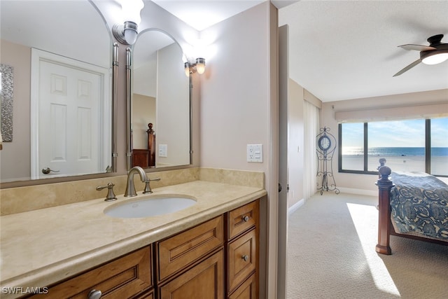 bathroom featuring ceiling fan and vanity