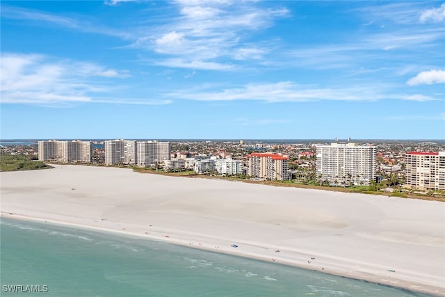 drone / aerial view with a water view and a view of the beach