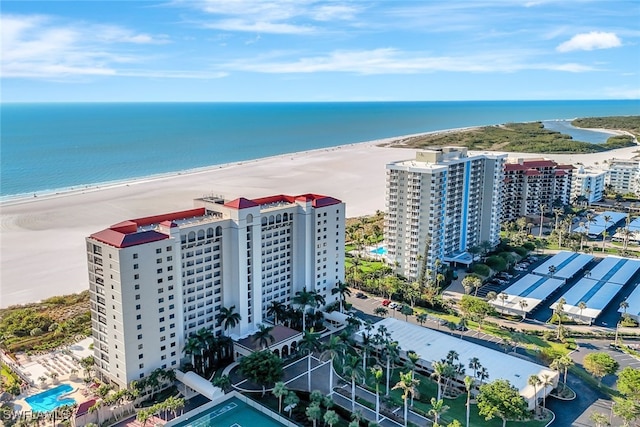 aerial view featuring a water view and a beach view