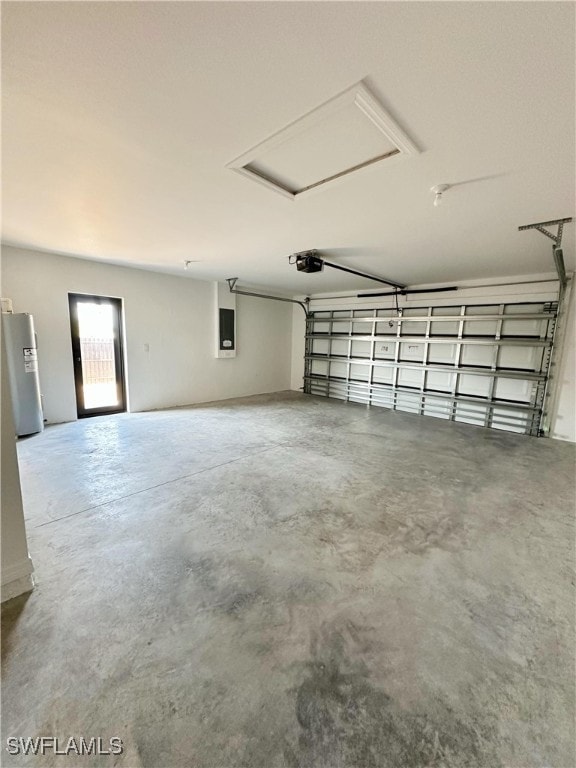 garage with electric panel, stainless steel fridge, and a garage door opener