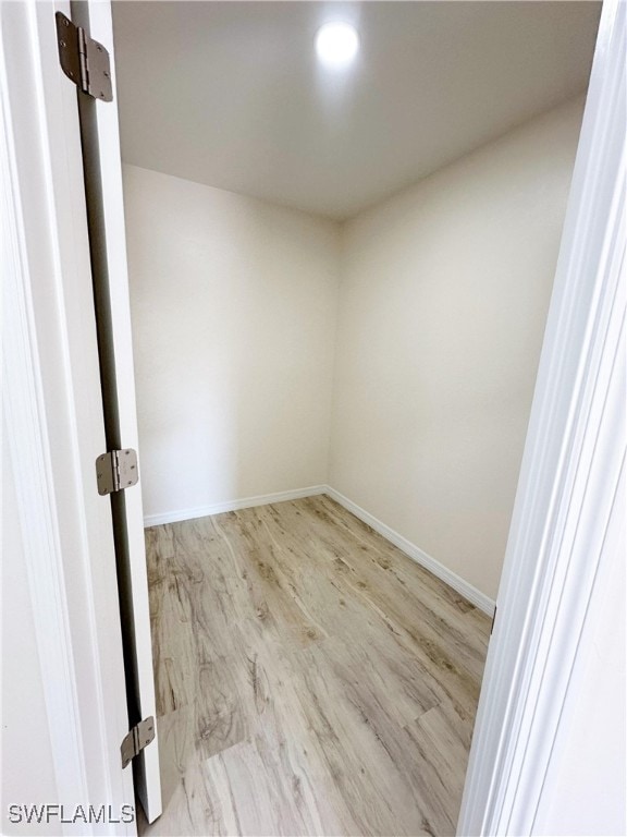 empty room with light hardwood / wood-style floors