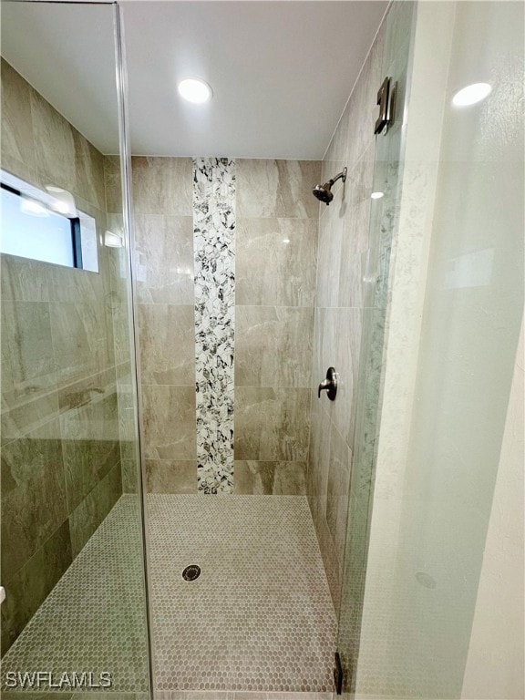 bathroom featuring an enclosed shower