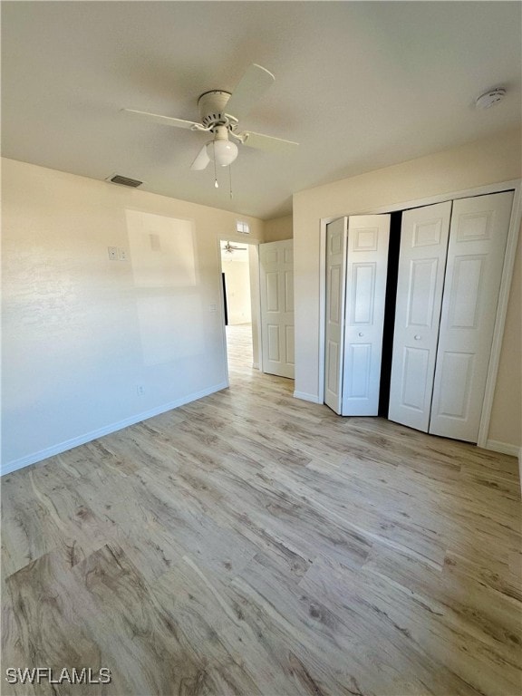 unfurnished bedroom with a closet, ceiling fan, and light hardwood / wood-style floors