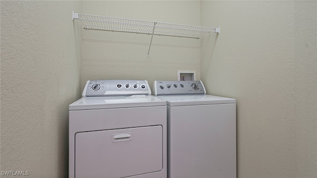 laundry area featuring washing machine and clothes dryer