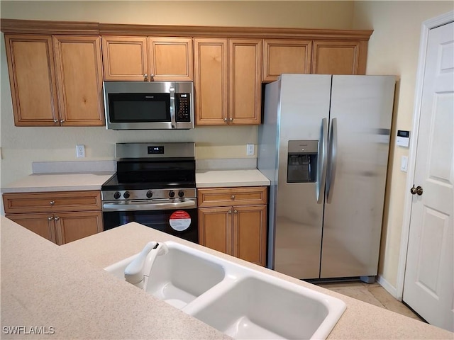 kitchen featuring sink and appliances with stainless steel finishes