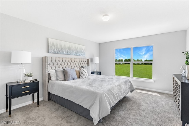 bedroom with light carpet