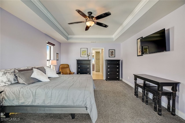 carpeted bedroom featuring a raised ceiling, ceiling fan, and crown molding