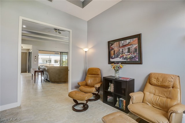 sitting room featuring ceiling fan and ornamental molding