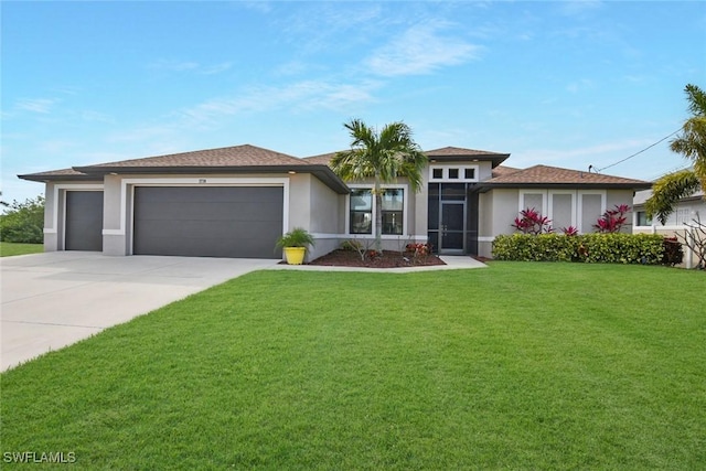 view of front facade featuring a front yard and a garage