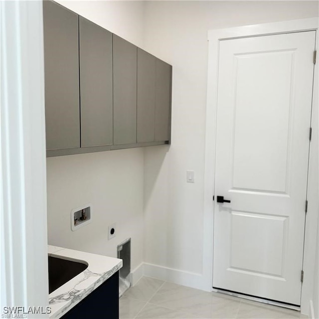 laundry room featuring sink, washer hookup, cabinets, hookup for an electric dryer, and light tile patterned flooring