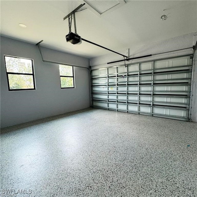 garage featuring a garage door opener