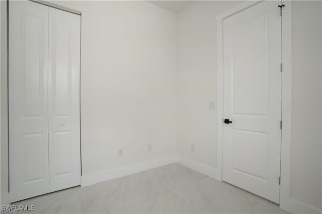 unfurnished bedroom with light tile patterned floors