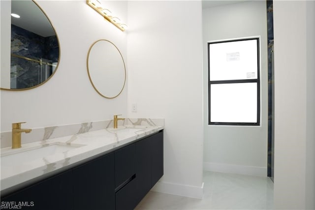 bathroom featuring plenty of natural light and vanity