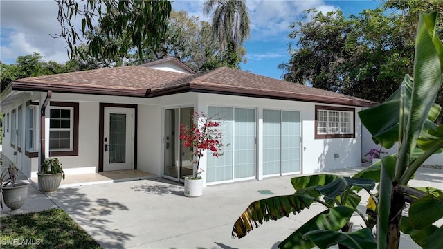 rear view of property featuring a patio area