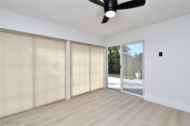 unfurnished room featuring ceiling fan and light hardwood / wood-style floors