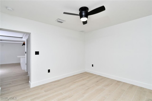 unfurnished room featuring light hardwood / wood-style flooring and ceiling fan