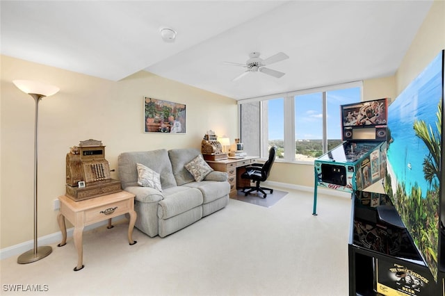 living room with ceiling fan and carpet