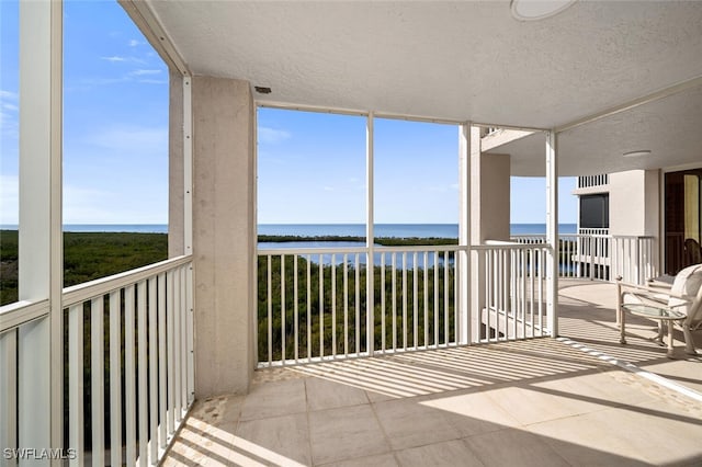 balcony featuring a water view