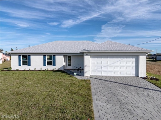 single story home with a front yard and a garage