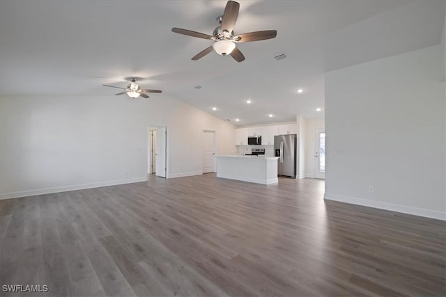 unfurnished living room featuring ceiling fan, wood-type flooring, and vaulted ceiling