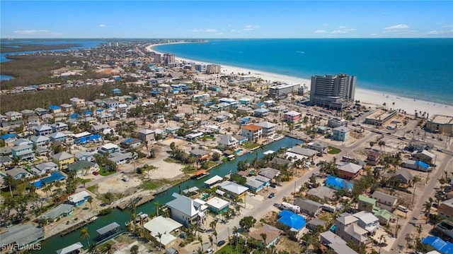 birds eye view of property with a view of the beach and a water view