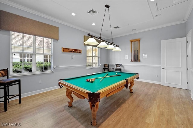 game room featuring plenty of natural light, light wood-type flooring, ornamental molding, and pool table