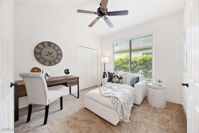 carpeted bedroom with ceiling fan and a closet