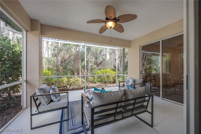 sunroom featuring ceiling fan