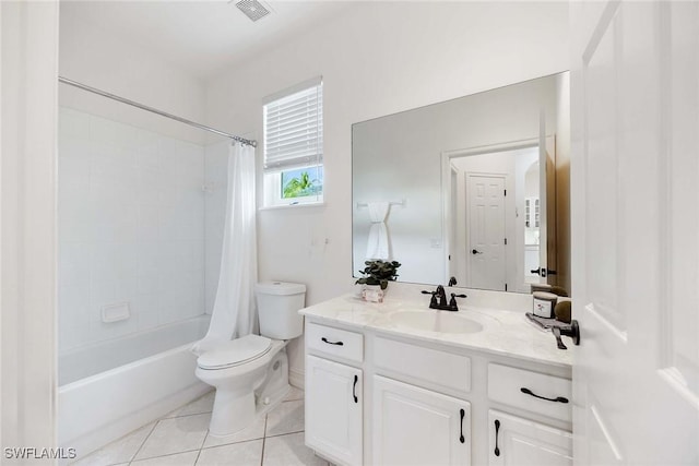 full bathroom with tile patterned flooring, vanity, toilet, and shower / bath combo with shower curtain