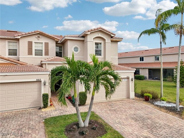 mediterranean / spanish-style home featuring a front yard