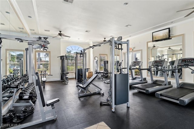 exercise room featuring ceiling fan and crown molding