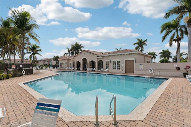 view of swimming pool featuring a patio area