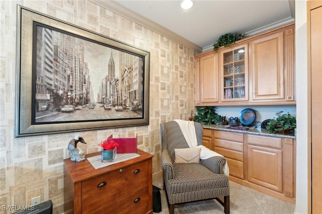 living area featuring crown molding and light carpet