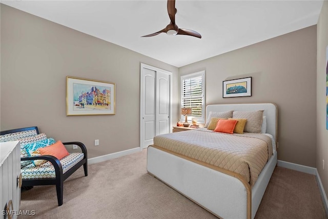 bedroom with light carpet, a closet, and ceiling fan