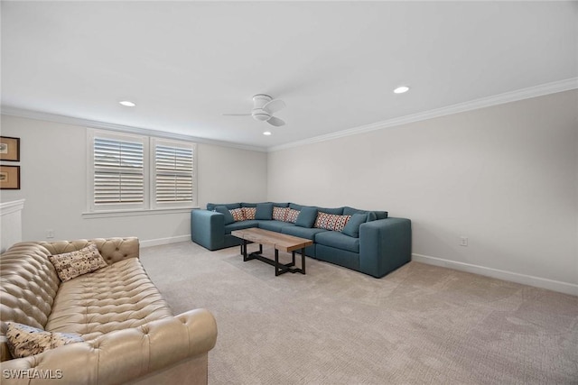 carpeted living room featuring ceiling fan and crown molding