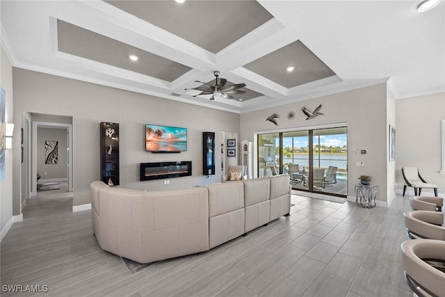 living room featuring beamed ceiling, ceiling fan, crown molding, and coffered ceiling