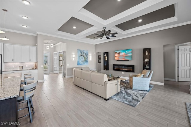 living room with beamed ceiling, ceiling fan, crown molding, and coffered ceiling