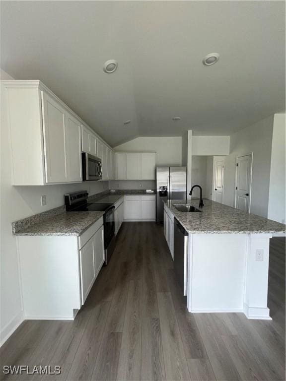 kitchen featuring light stone counters, sink, white cabinets, and appliances with stainless steel finishes